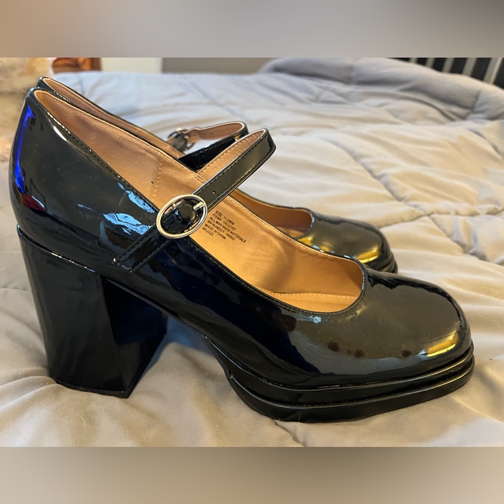 Brand new black patent platform Mary Janes.